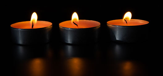 Lit votive candles Lit votive candles