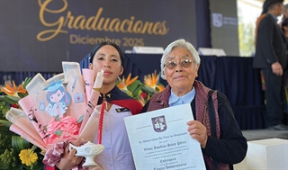 Sister at graduation ceremony with student